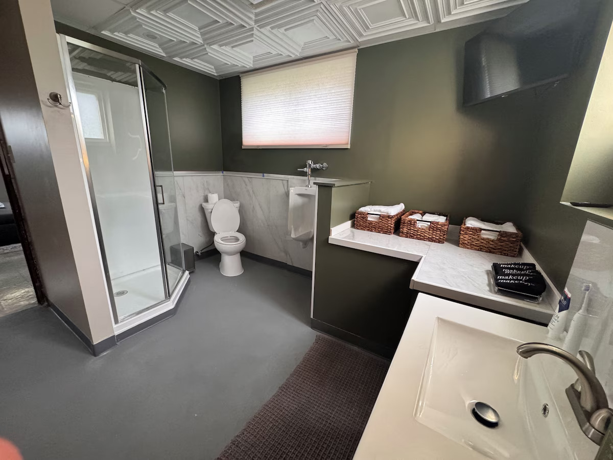 Scoreboard bath — walk-in shower